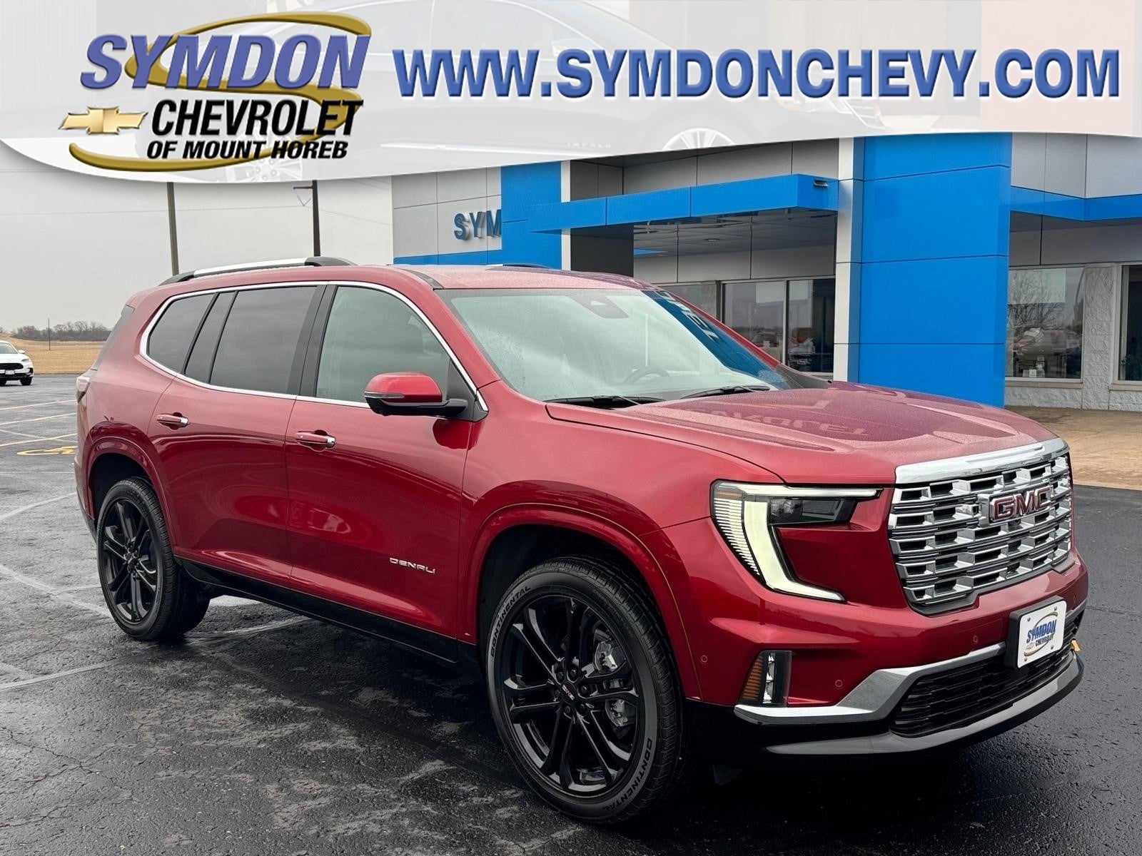 2026 GMC Acadia Denali in Volcanic Red Tintcoat — front three-quarter view