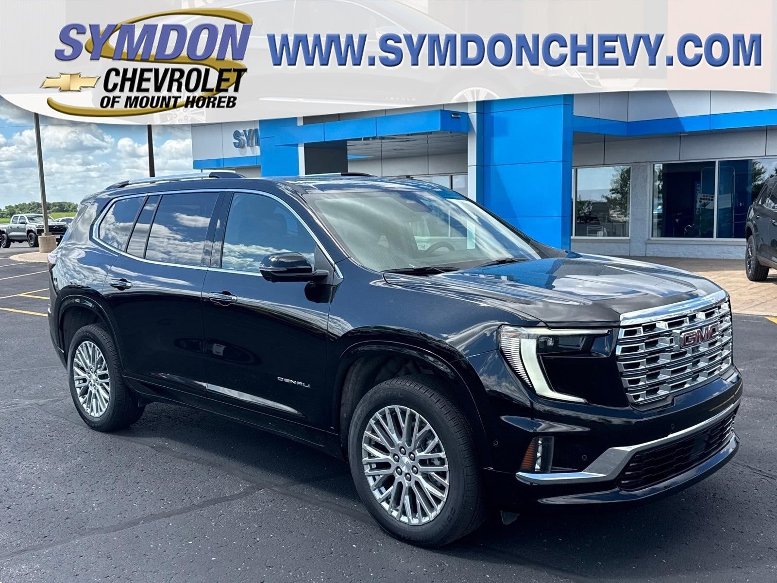 2026 GMC Acadia Denali in Ebony Twilight Metallic — front three-quarter view