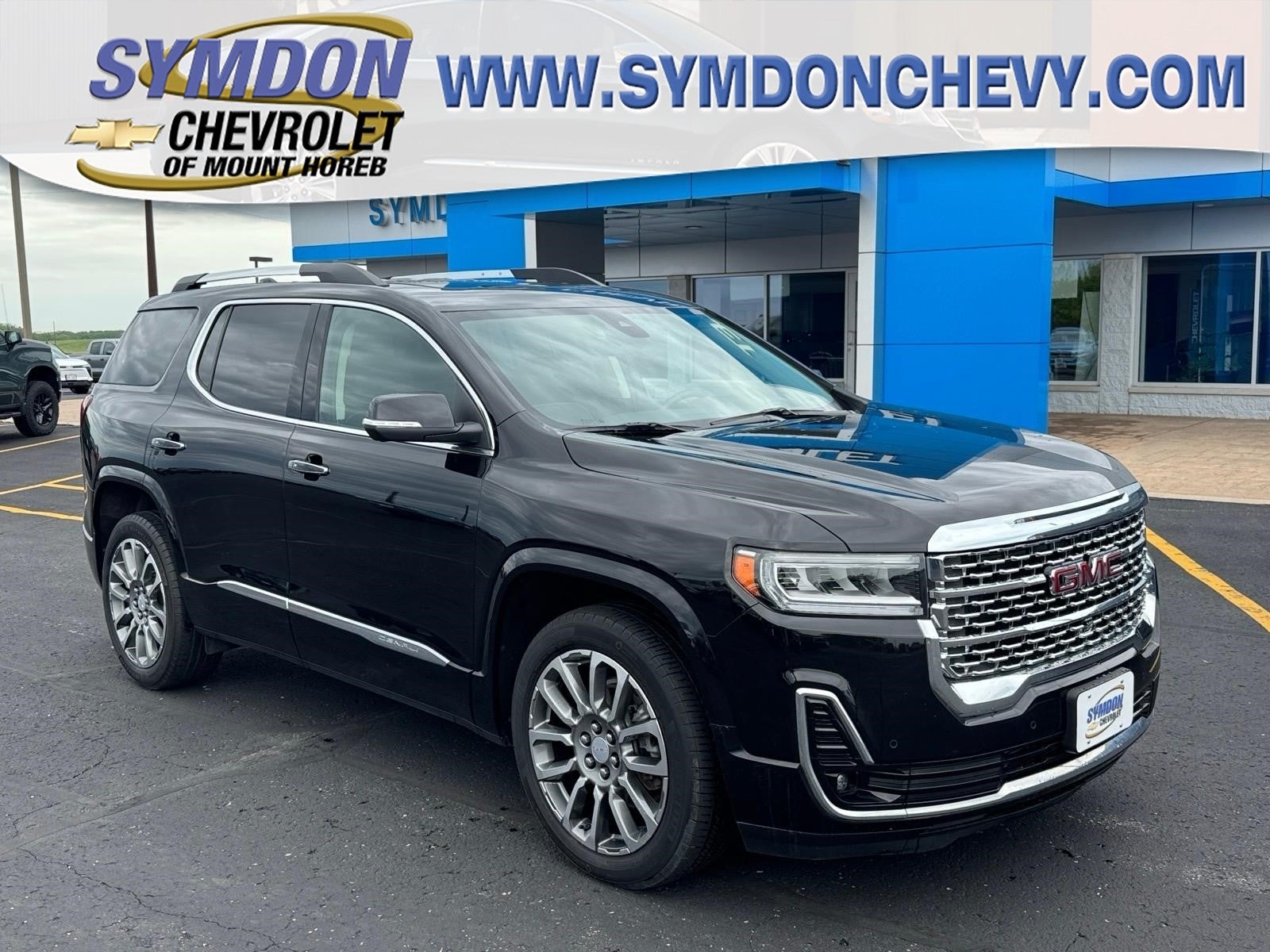 2023 GMC Acadia Denali in Ebony Twilight Metallic — front three-quarter view