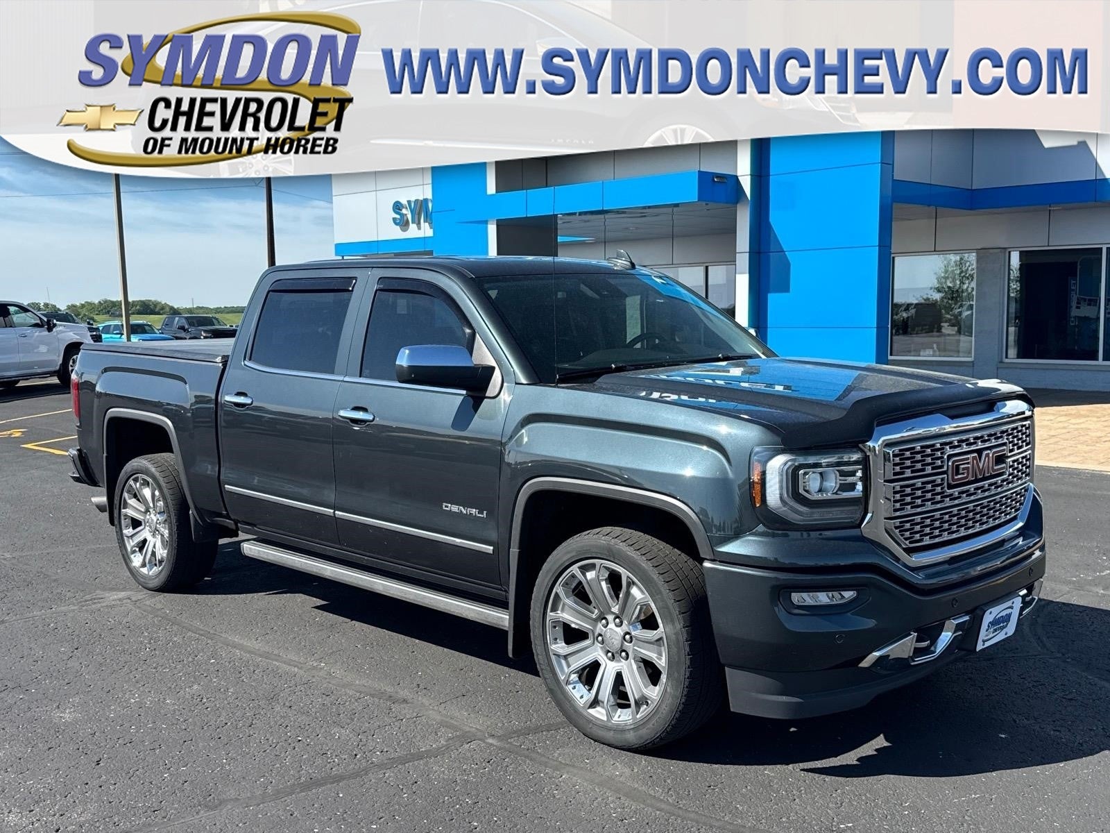 2018 GMC Sierra 1500 Denali in Dark Slate Metallic — front three-quarter view