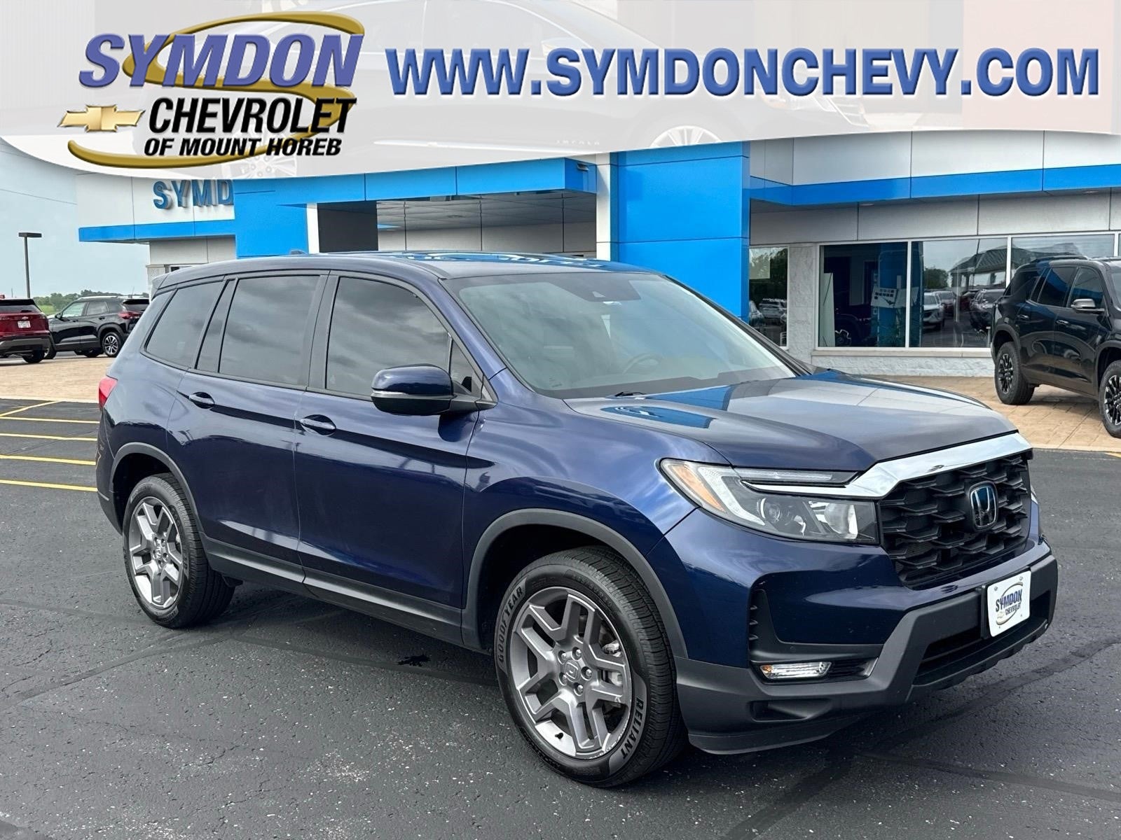 2023 Honda Passport AWD EX-L in Blue — front three-quarter view