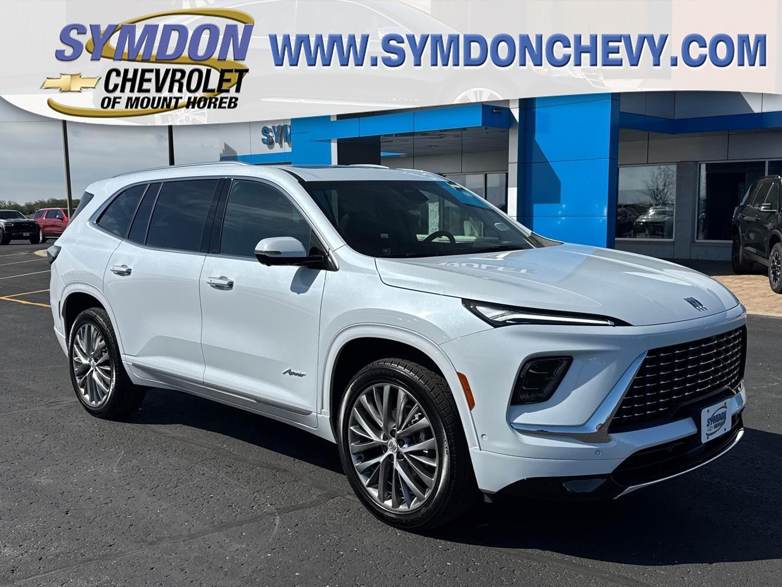 2026 Buick Enclave Avenir in Iridescent White Tricoat — front three-quarter view